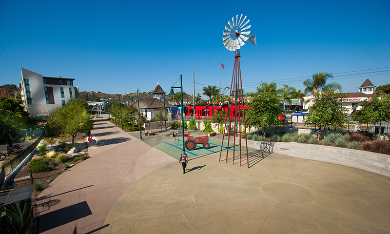 Art installations, streetlamps, smooth pavement, and concrete seating decorate the newly enhanced Lemon Grove Trolley Plaza. 