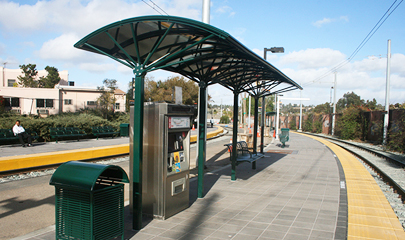 Renovated station area shown with trolley tracks running on both sides of a platform.